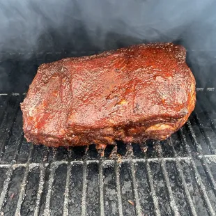  pork roasting on a grill