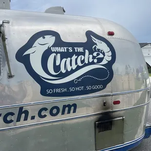 a silver and blue trailer