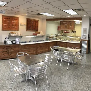 a restaurant with tables and chairs