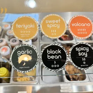 a display of different flavored donuts