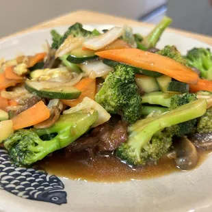 broccoli, carrots, and onions on a plate