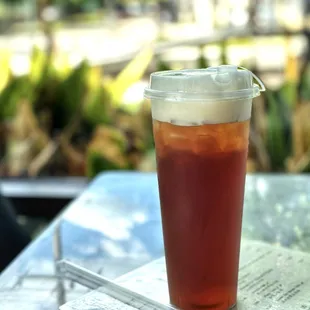 a glass of iced tea on a table