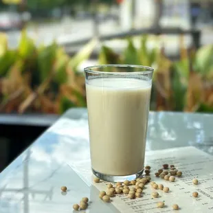 a glass of milk on a table