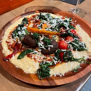 a pizza on a wooden plate