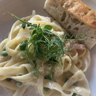 Tagliatelle with Mushrooms, Peas, Cream and Parmesan (housemade Gluten Free Rigatoni Available)