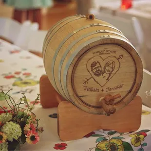 The wedding gift barrel. With Josh &amp; Jen&apos;s faces engraved on the front.