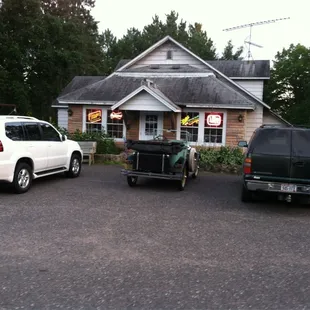 two vehicles parked in front of a building
