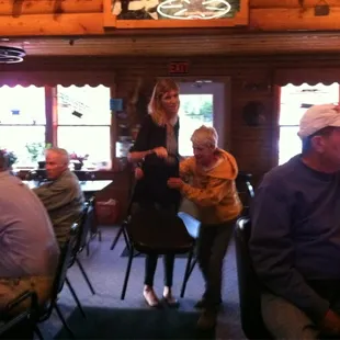 a group of people sitting at tables