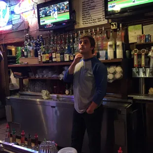a man standing at the bar