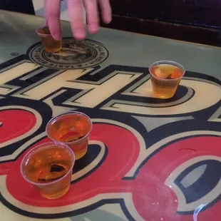 a table with beer glasses on it