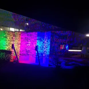 Colorful electric word art by the front door.