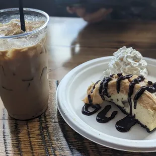 a slice of cheesecake and a drink