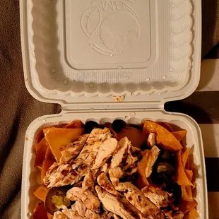 Nacho  Supreme Jelepeno,  Chicken., Onion, Red Pepper., Olives., Black Beans,American  Cheese  mixed  also  with  Chirozo  Spiced Meat!