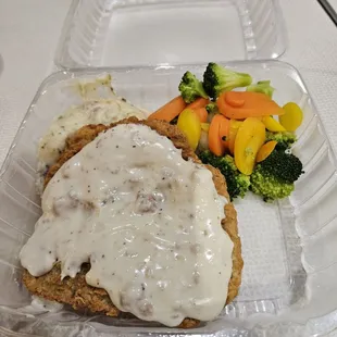 Chicken fried steak special  with  mashed potatoes and steam vegetables