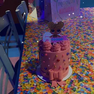 a birthday cake with a cat on top