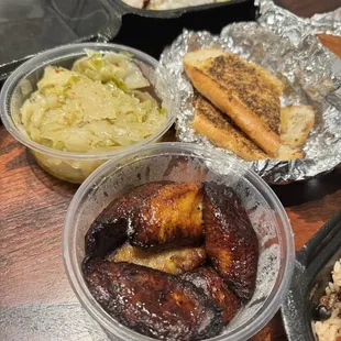 Sides of plaintains, steamed cabbage and included bread