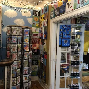 Instructional cards with suggested paintings (in the display rack); finished paintings are hung throughout