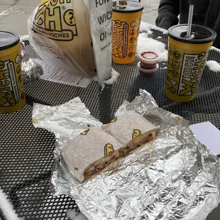 a sandwich and drink on a table