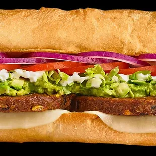 a sandwich with lettuce, tomato, and onion