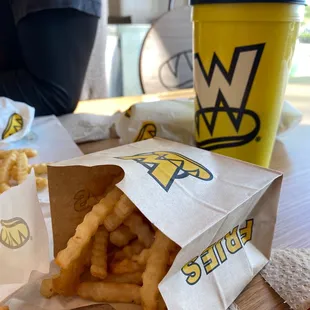 a bag of fries and a cup of coffee