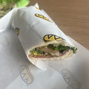 Grinder with veggies, pesto sauce, and Tomato &amp; Avocado