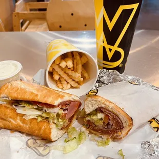 a sandwich and fries on a table