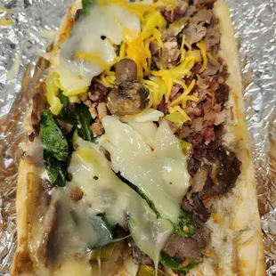 Made with provolone cheese, swiss cheese, cucumbers, banana peppers, mushrooms, &amp; spinach.