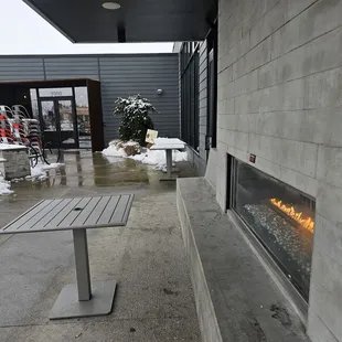 a patio with a fire place