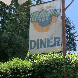 a sign for a diner