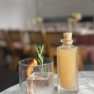 a glass of gin and a bottle of gin