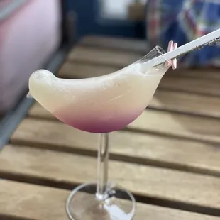 a glass with a drink in it