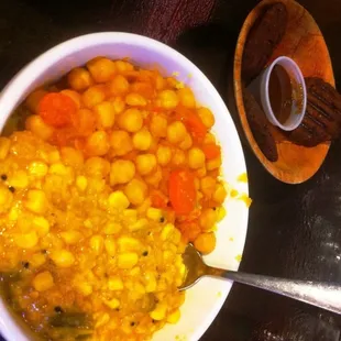 Veggie Combo Rice Bowl, with Chana Masala &amp; Zambian Corn.  Dal Puppies in the back.