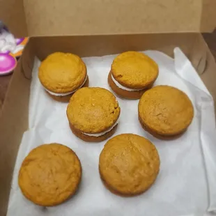 a box of mini pumpkin cupcakes