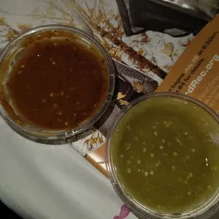 Two types of salsa one green not spicy and one red very good and spicy