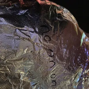 a close up of a wrapped up pastry