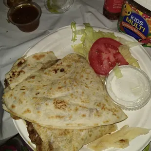 Quesadilla with carne asada. Very cheesy so thats good and meat quality is poor.