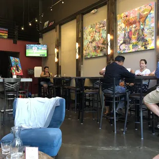 There's one seating area with a couch &amp; 4 cushy chairs for a larger group, 6-8 highball tables and approx 12 chairs at the bar.