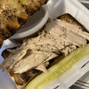 Hot turkey sandwich on ciabatta with gravy on the side