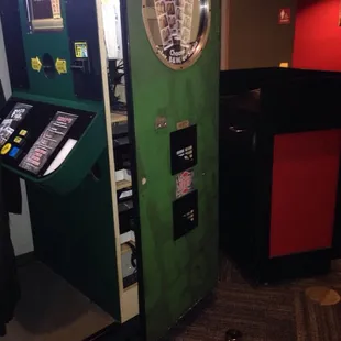 The broken photo booth. Lock for the money slot on the floor