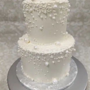 Mini tiered cake with edible sugar pearls.