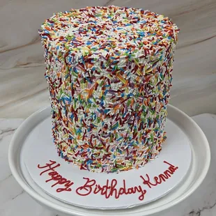 We hope you love sprinkles! 6" Extra Tall cake, covered in Rainbow Sprinkles.