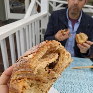 chocolate croissant, splitting it with husband on the patio