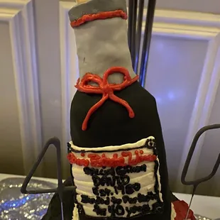 Lumpy neck of the bottle with sloppy bow