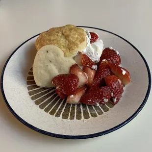 Yummy homemade strawberry shortcake for dessert, even a heart shaped cookie on the side