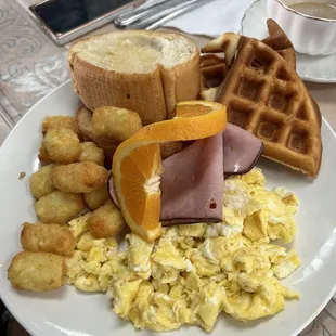 Full breakfast with ham and waffles