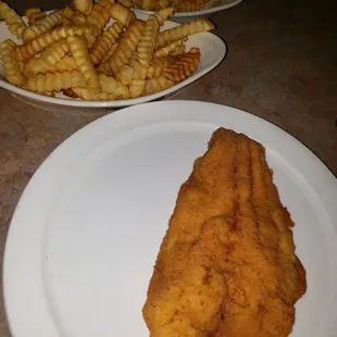 One catfish fillet along with double orders of fries