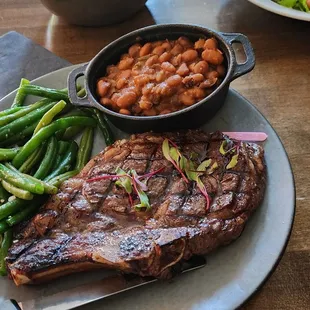 Thursday steak night. 16 oz bone in ribeye, salad, 2 sides, dessert