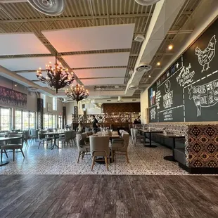 a restaurant with a chalkboard wall