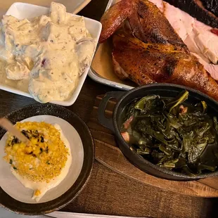 Potato salad, Mexican street corn, and collard greens