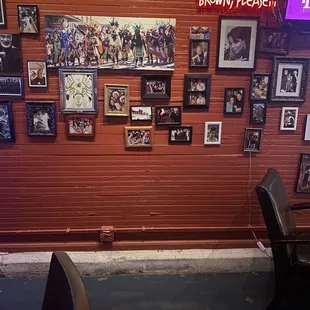 a wall full of framed photos